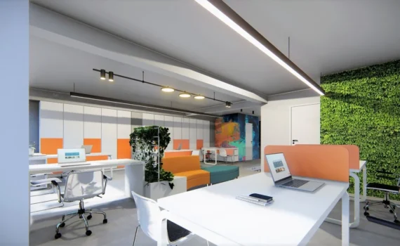 Ακουστική γραφείων σε open space με διαχωριστικά θέσεων εργασίας και πράσινο τοίχο