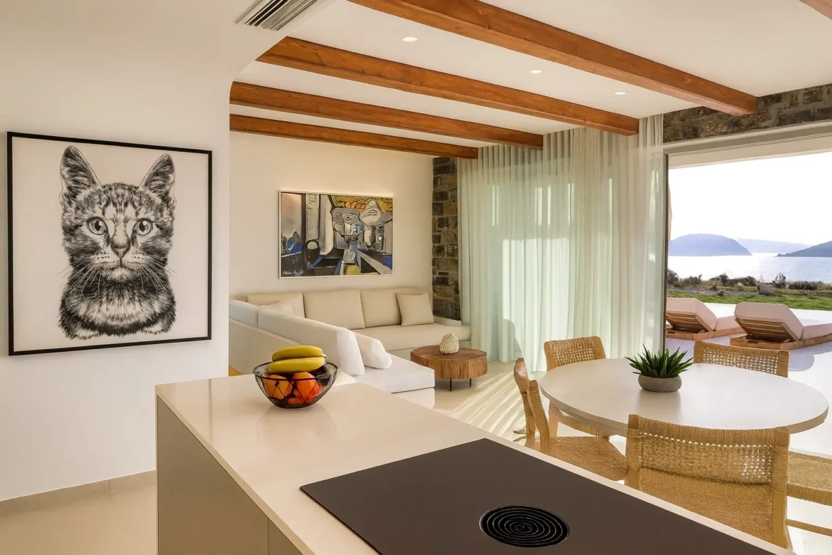 Open-plan living room and kitchen in a luxury holiday villa in Crete overlooking the sea