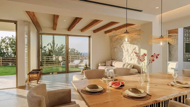 Luxury Villa – Malia, Crete | Interior Design • Exterior Design • Hospitality Design | Grammiki a Luxury Villa in Malia, Crete by Grammiki a featuring living and dining area