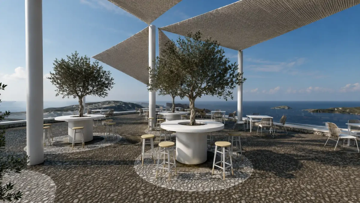 Υπαίθριο lounge σε wedding venue στη Σαντορίνη με ελιές, υφασμάτινα σκίαστρα και πανοραμική θέα στην Καλντέρα
