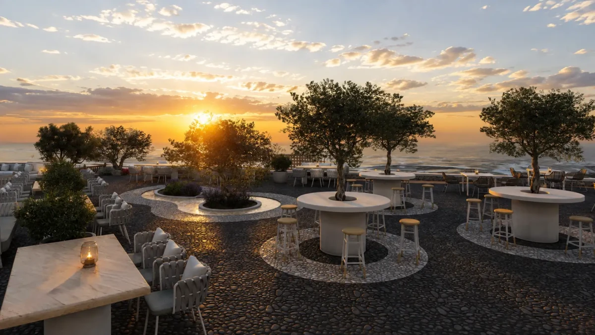 Υπαίθριο lounge σε wedding venue στη Σαντορίνη με ελιές, κυκλικά τραπέζια και θέα στο ηλιοβασίλεμα