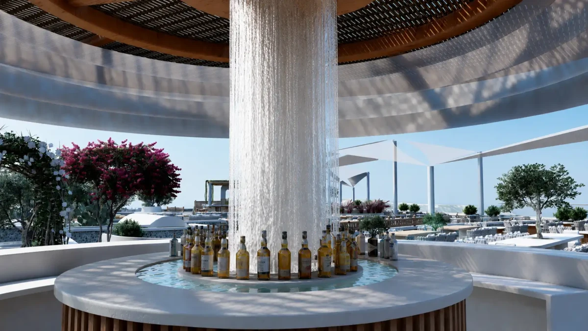 Κυκλικό outdoor bar σε wedding venue στη Σαντορίνη με κεντρική κολόνα νερού και ενσωματωμένο υδάτινο στοιχείο